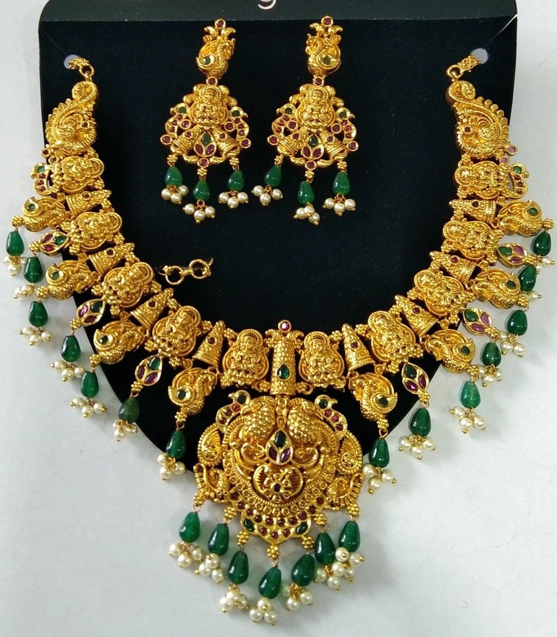 Temple Jewelry Necklace Set with green stones.